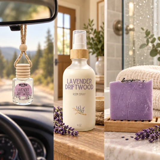 Lavender Driftwood car freshener hanging from a rearview mirror, matching room spray on an entryway table, and purple bar soap beside a shower.